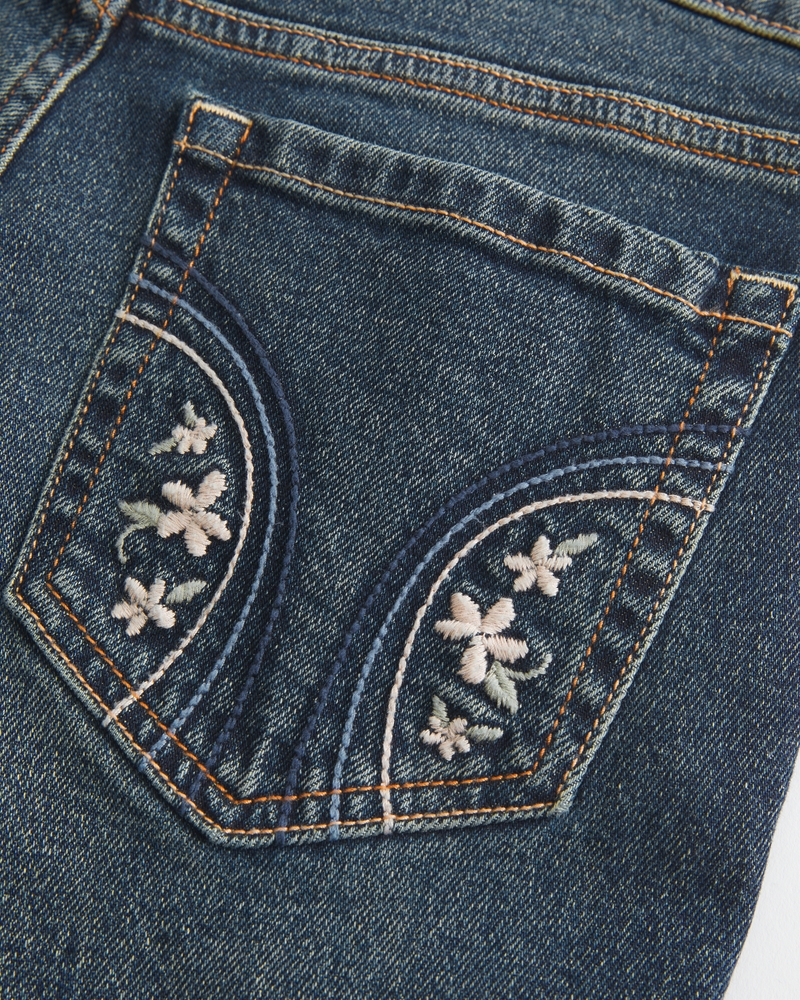 jeans bootcut a vita bassa effetto consumato lavaggio medio