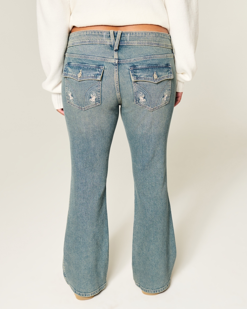 jeans bootcut a vita bassa effetto consumato lavaggio medio