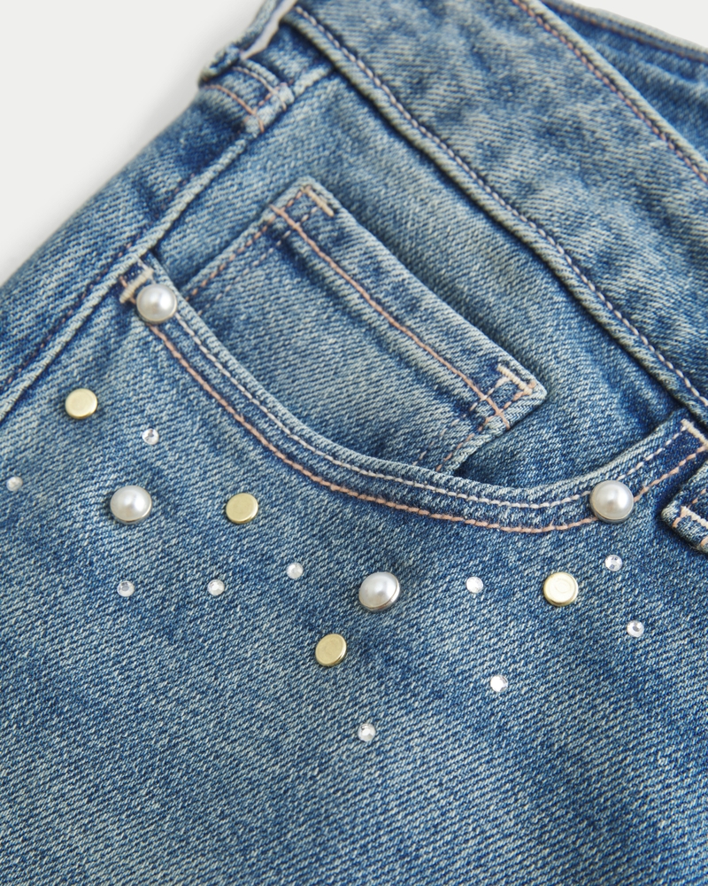 jeans bootcut a vita bassa effetto consumato lavaggio medio