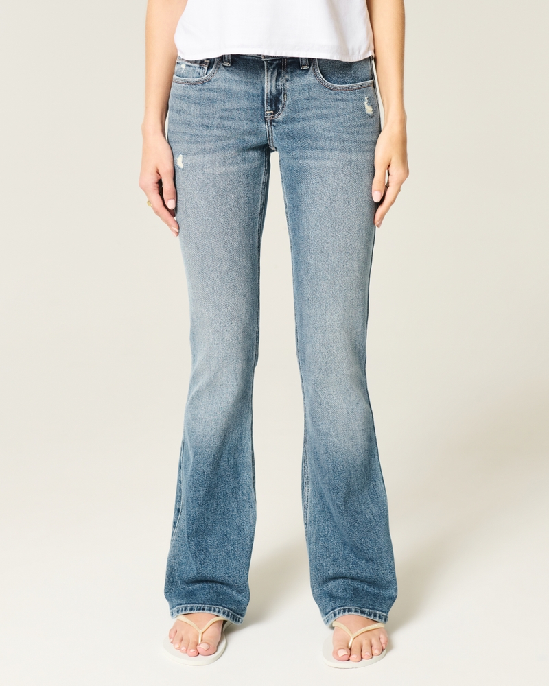 jeans bootcut con borchie lavaggio medio e vita bassa