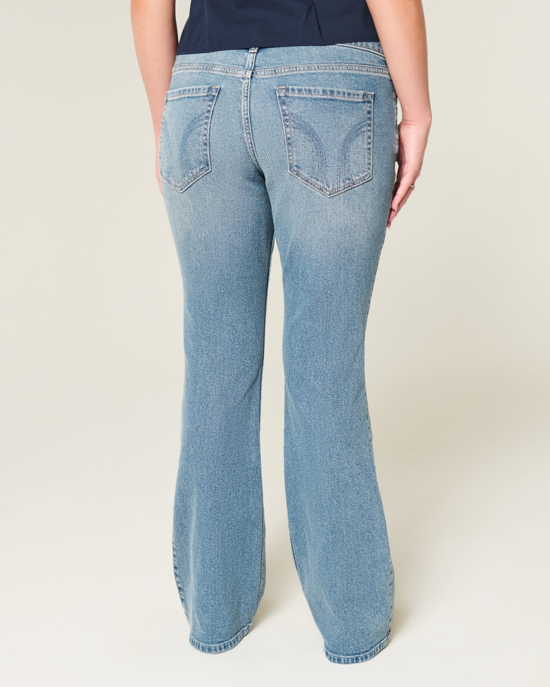 jeans bootcut con borchie lavaggio medio e vita bassa