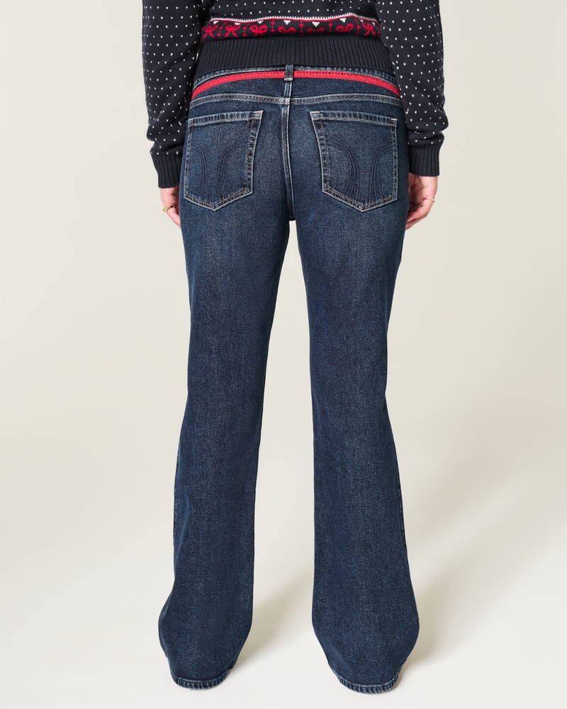 jeans bootcut con borchie lavaggio medio e vita bassa