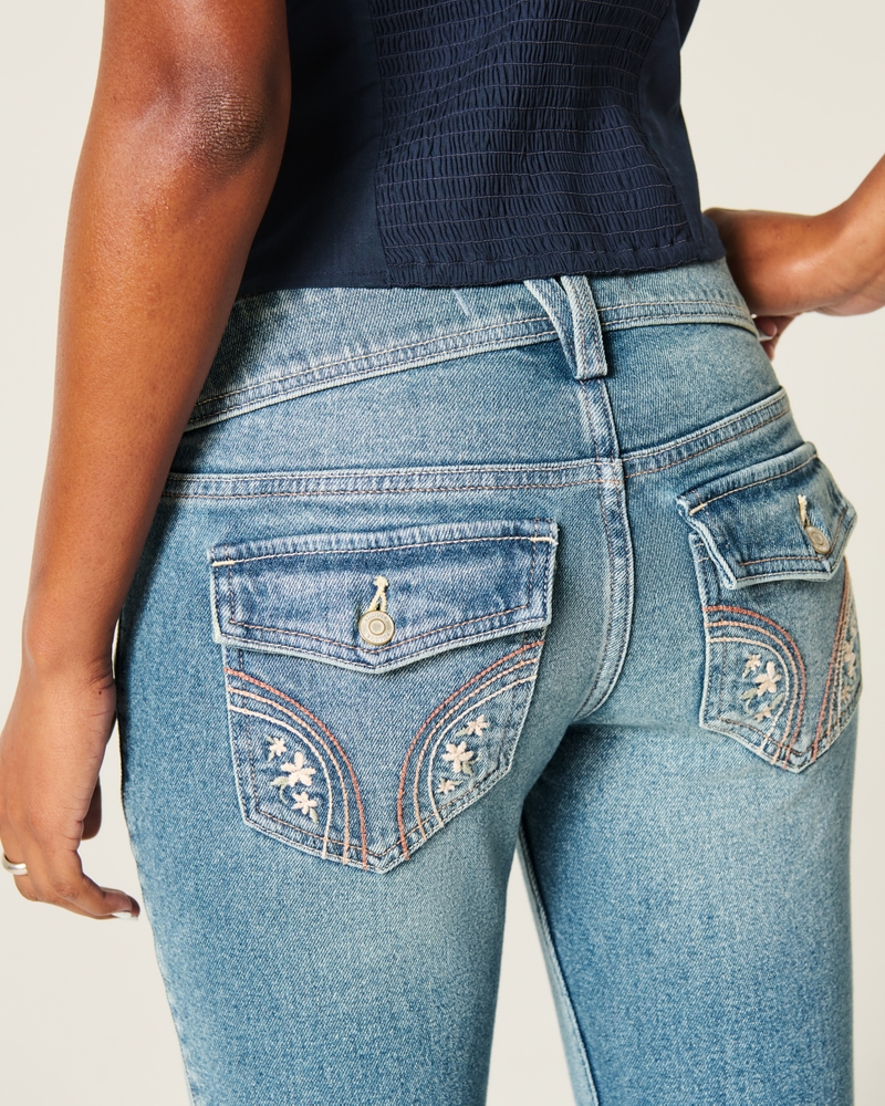 jeans bootcut a vita bassa con ricamo a farfalla e lavaggio medio