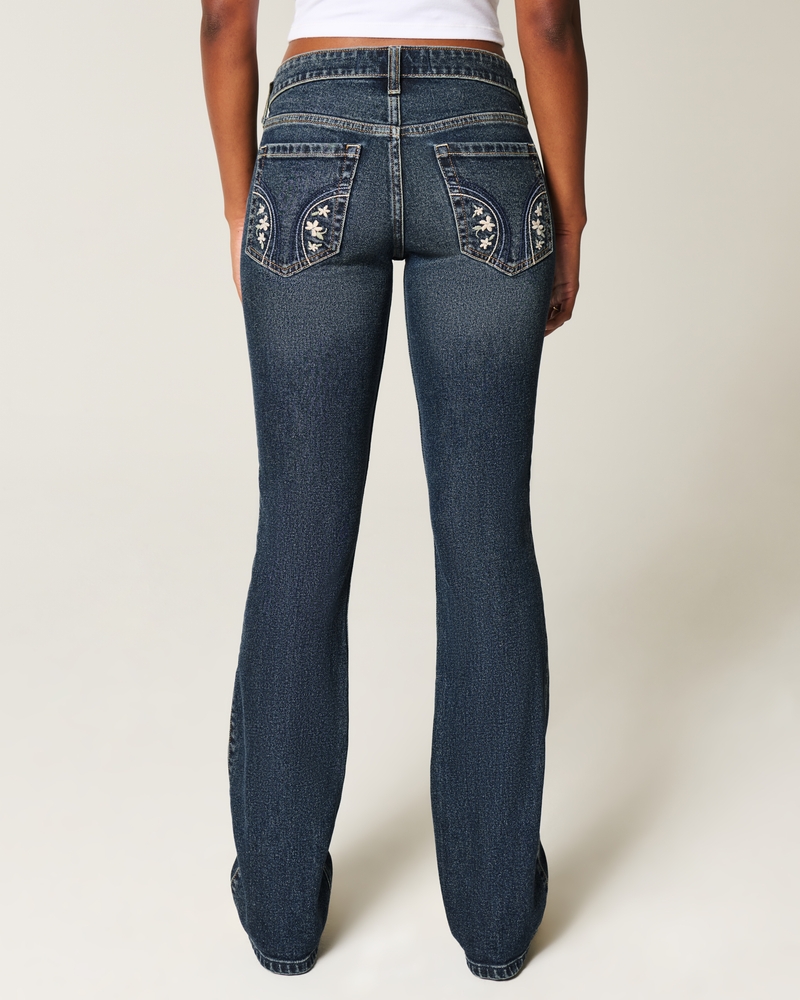 jeans bootcut a vita bassa con ricamo a farfalla e lavaggio medio