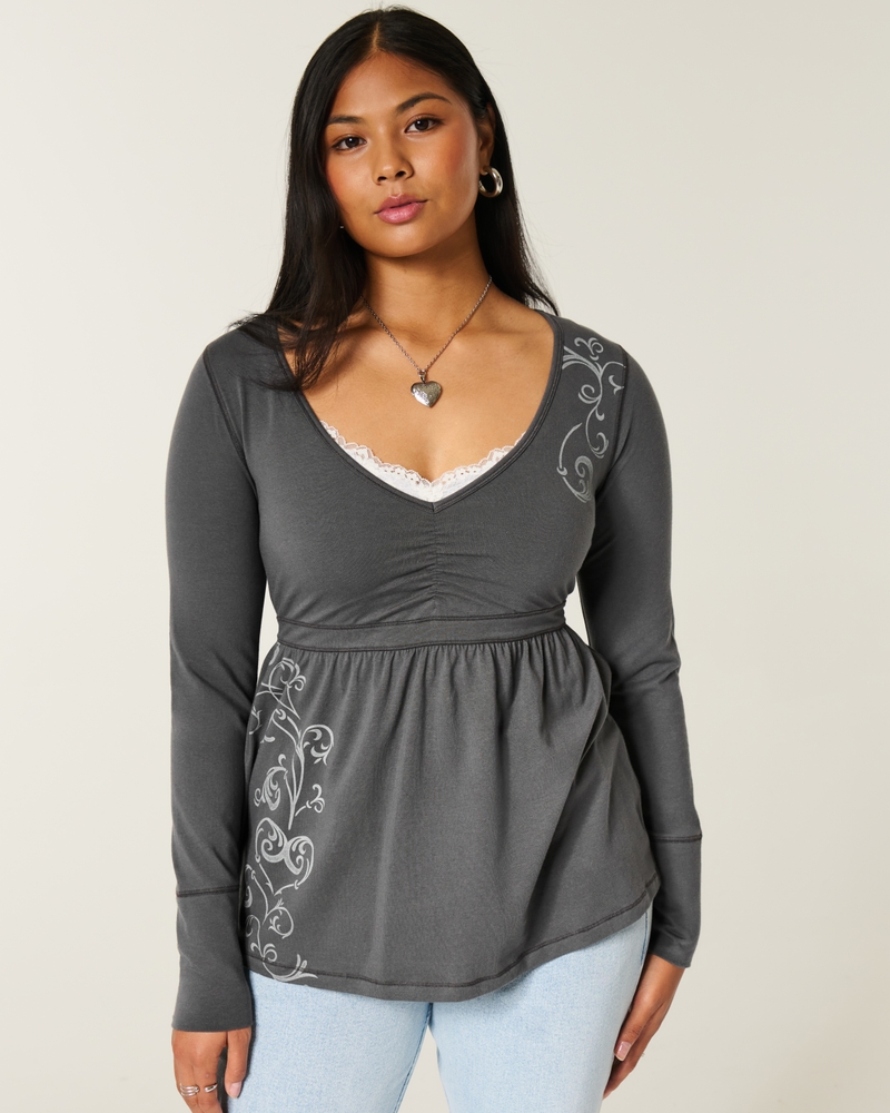 top babydoll con corpetto arricciato a maniche lunghe e motivo sul petto