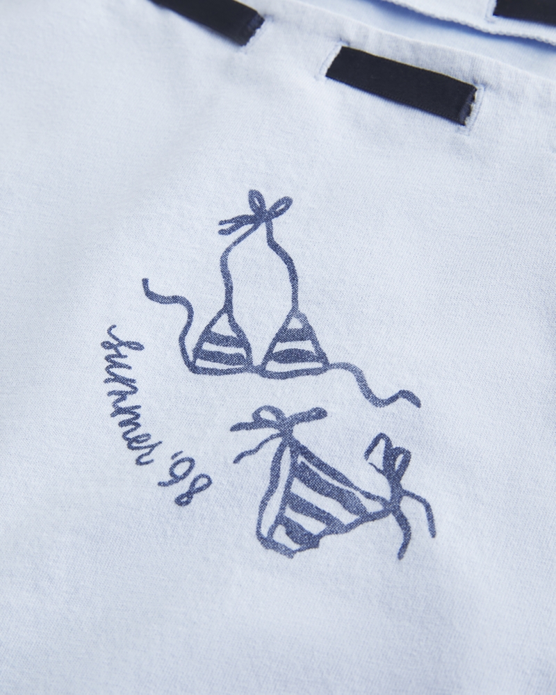 t-shirt ampia con spalle scoperte e nodo sul davanti