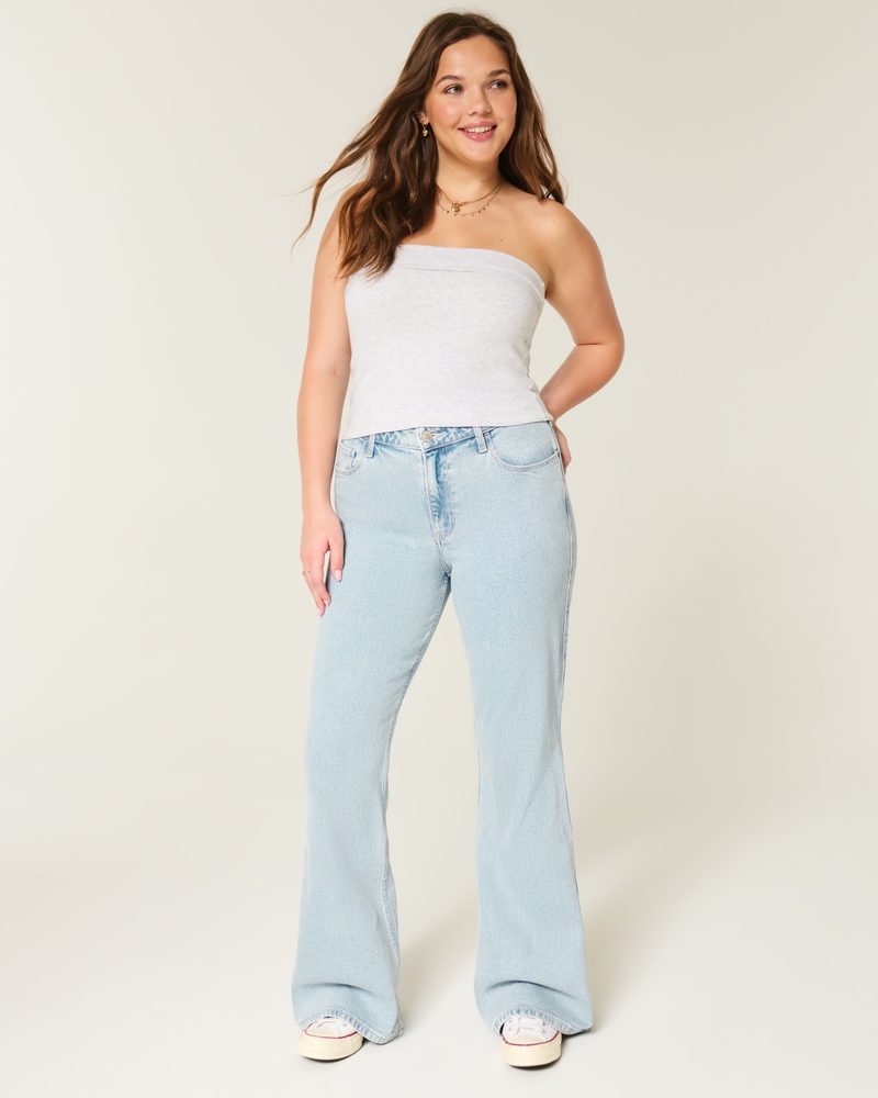 jeans svasati a vita alta lavaggio chiaro con ricamo a cuore