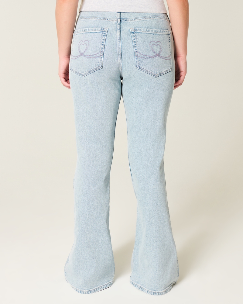 jeans svasati a vita alta lavaggio chiaro con ricamo a cuore
