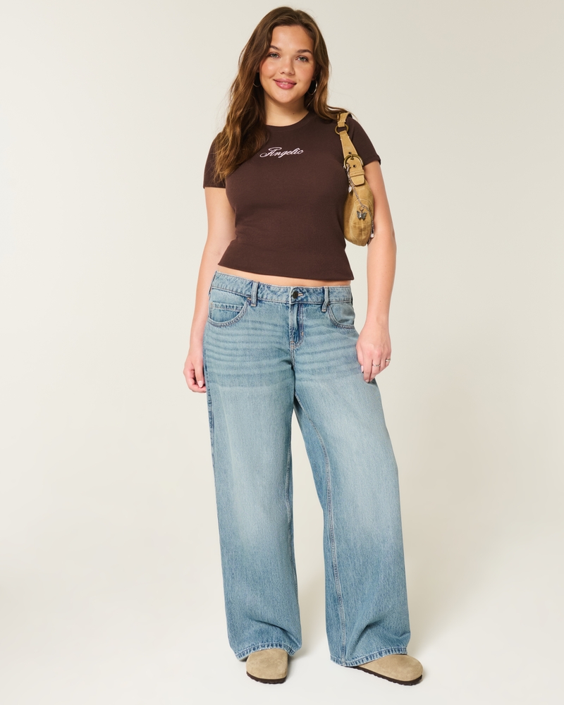 jeans super larghi strappati e lavaggio chiaro a vita bassa
