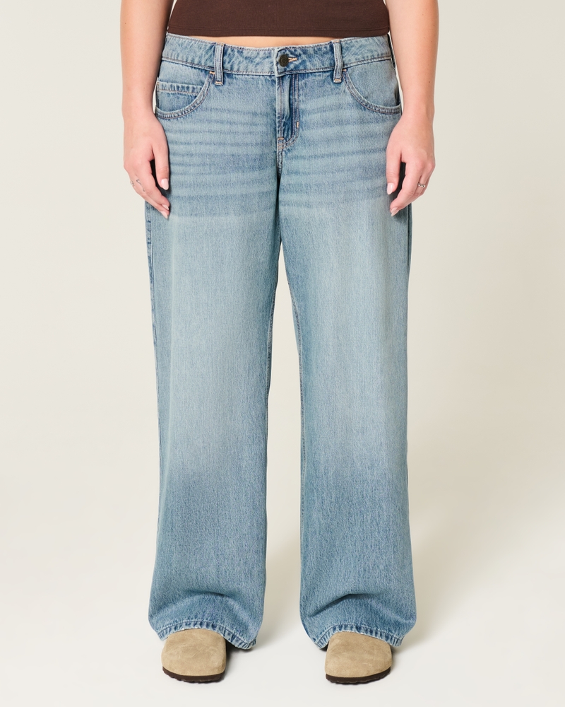 jeans super larghi strappati e lavaggio chiaro a vita bassa