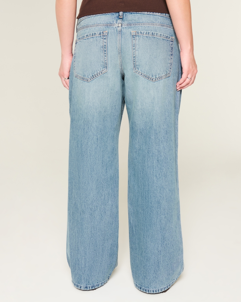 jeans super larghi strappati e lavaggio chiaro a vita bassa