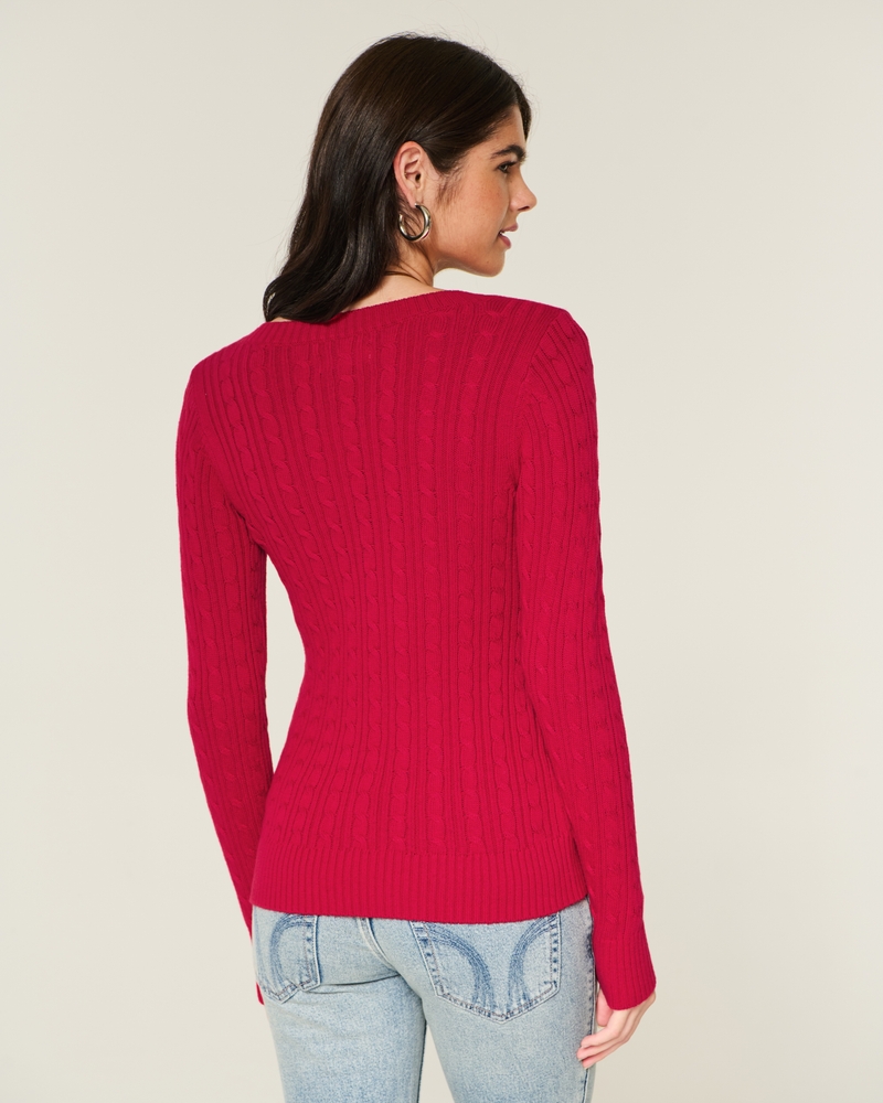 maglione con scollo a v e motivo a trecce