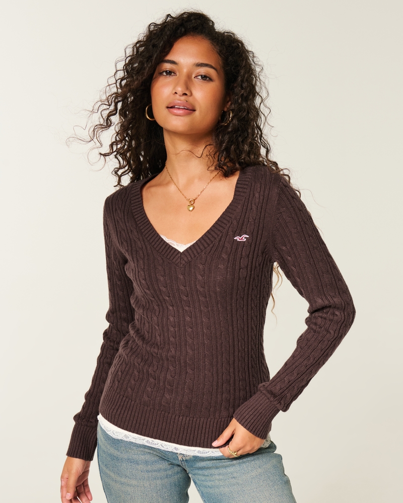 maglione con scollo a v e motivo a trecce