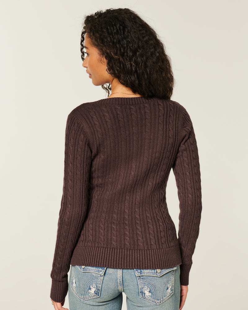 maglione con scollo a v e motivo a trecce