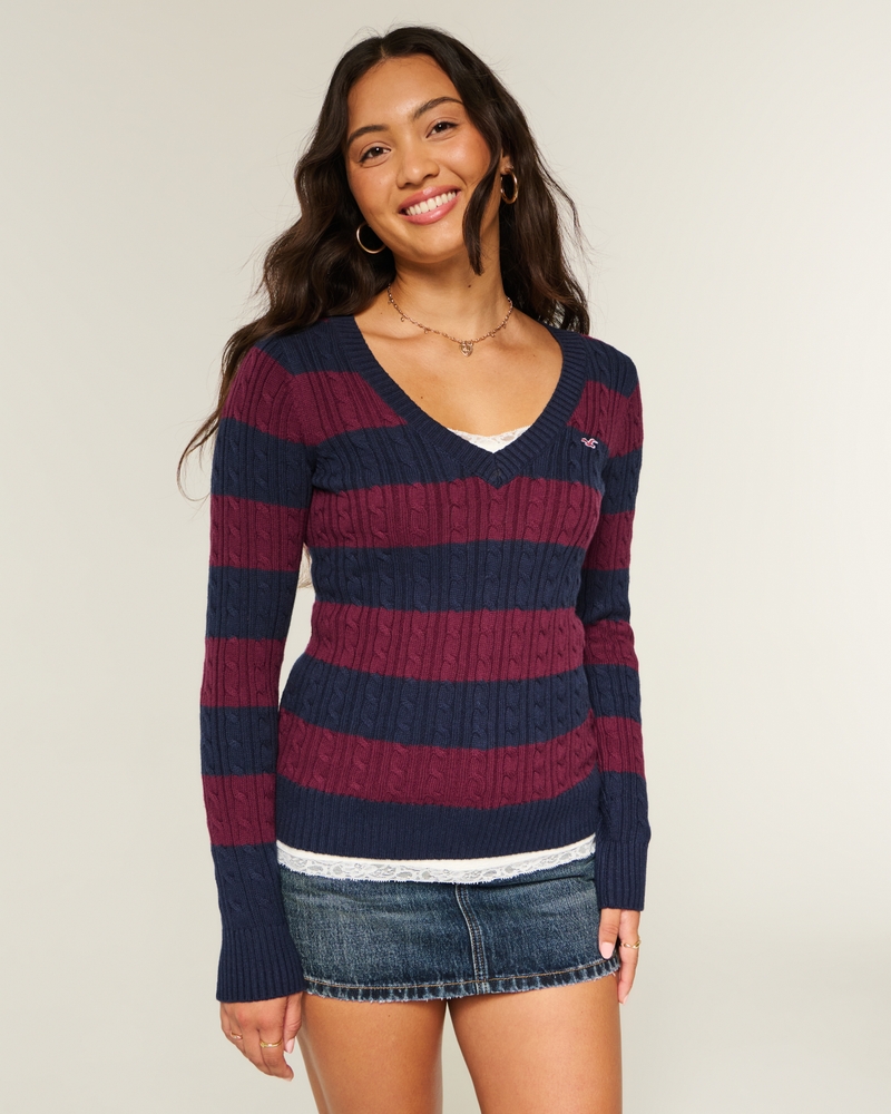 maglione con scollo a v e motivo a trecce
