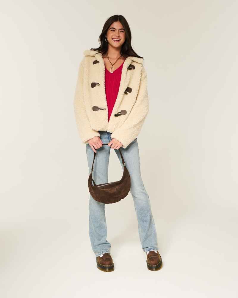 maglione con scollo a v e motivo a trecce