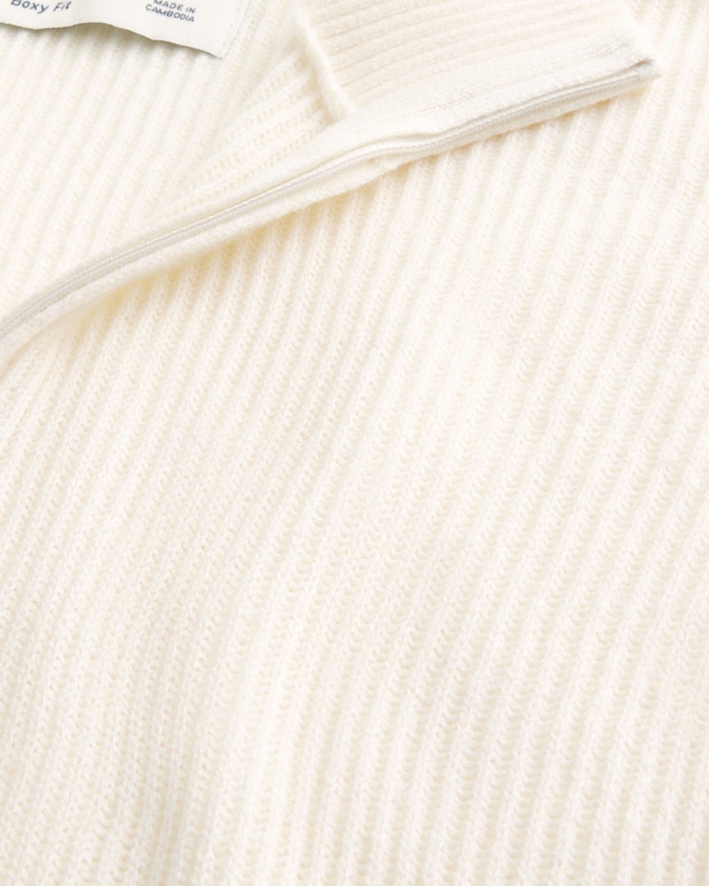 maglione con cerniera a un quarto di forma quadrata